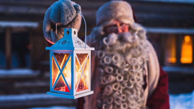 santa with lantern in lapland